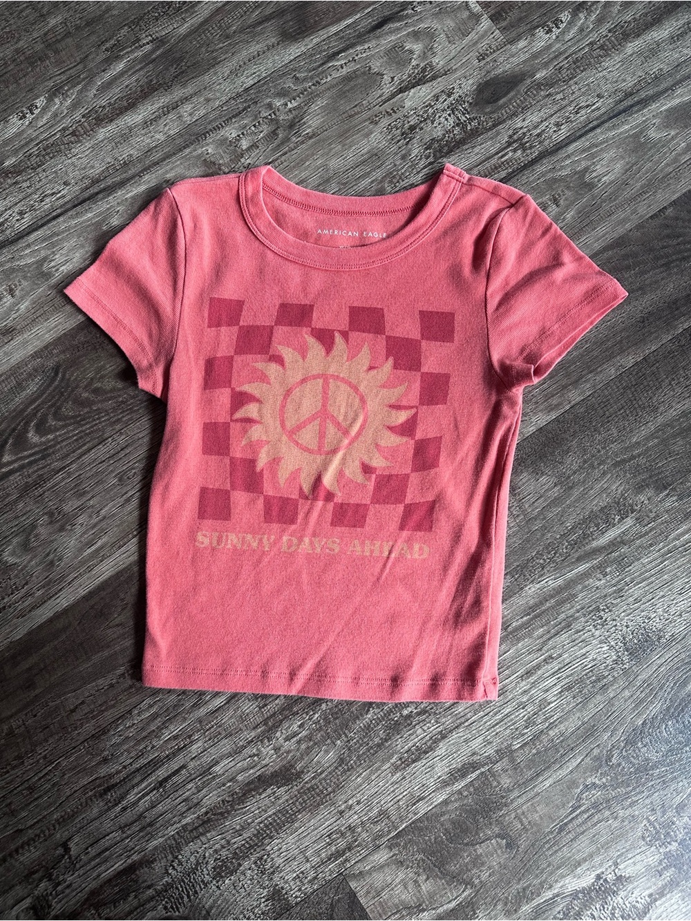 American Eagle Outfitters Pink Checkerboard Sun Graphic Baby Tee